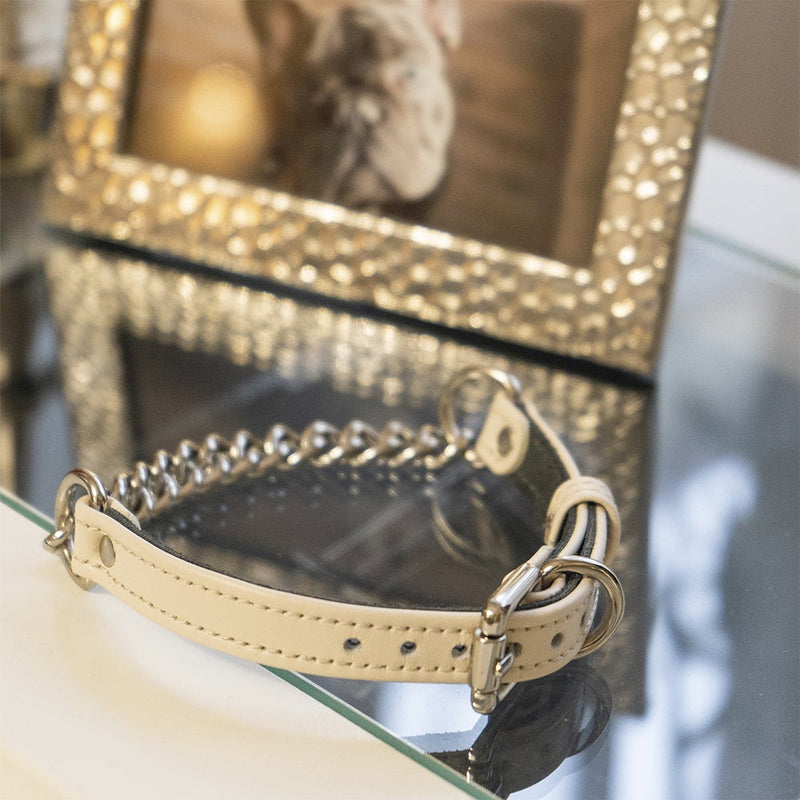 Beige collar with chain on Table