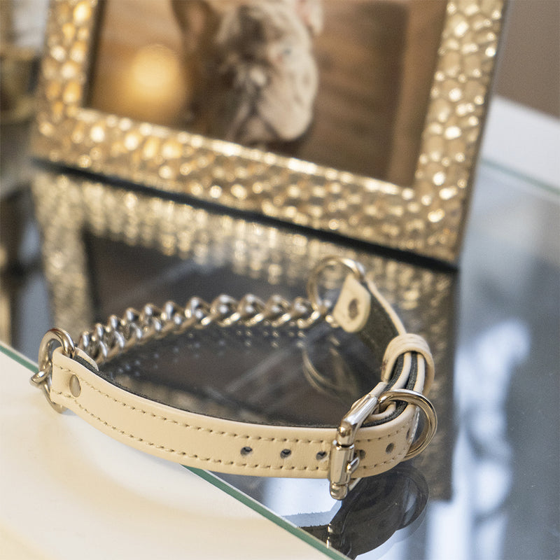 Beige collar with chain on Table